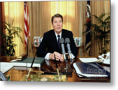 1980-1989 Metal Print featuring the photograph Ronald Reagan In The Oval Office by Bettmann