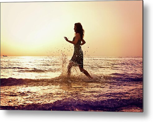 Three Quarter Length Metal Print featuring the photograph Running Into The Sea At Sunrise by Elisa Severi