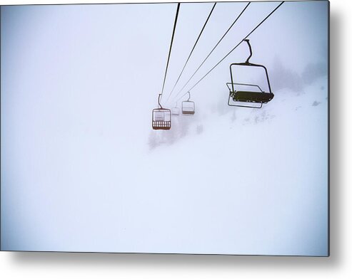 Ski Lifts Metal Print featuring the photograph Ski Lifts On Snow Covered Landscape by Cavan Images