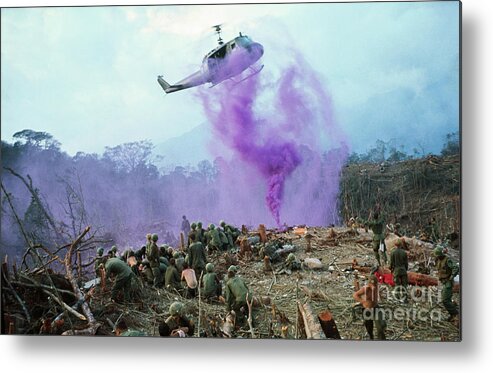 Vietnam War Metal Print featuring the photograph Smoke Flares Guiding A Helicopter by Bettmann