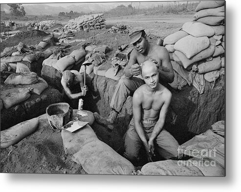 Vietnam War Metal Print featuring the photograph Soldier Shaving Colleagues Head by Bettmann