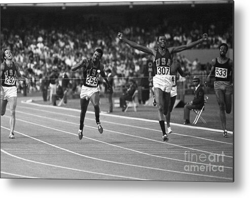 Young Men Metal Print featuring the photograph Sprinter Tommie Smith Winning 200-meter by Bettmann
