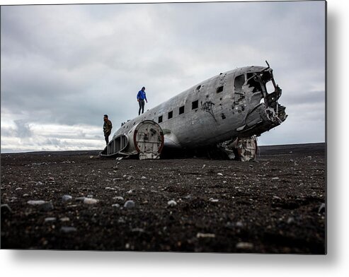 Plane Crash Metal Print featuring the photograph The Fuselage Of A Crashed Us Navy Dc-3 Plane Near Vik, Iceland. by Cavan Images