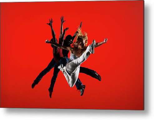 Ballet Dancer Metal Print featuring the photograph Three Dancers Leaping On Stage by Thomas Barwick