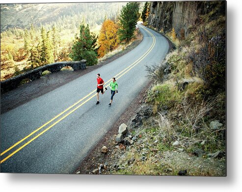 Runners Metal Print featuring the photograph Two Runners In Their Mid 20s Running Along Scenic Road In Rowena by Cavan Images