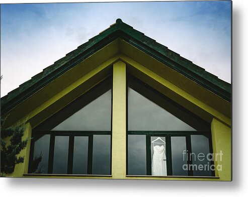 Background Metal Print featuring the photograph Wedding dress hanging from a window seen from outside with intense blue sky. by Joaquin Corbalan