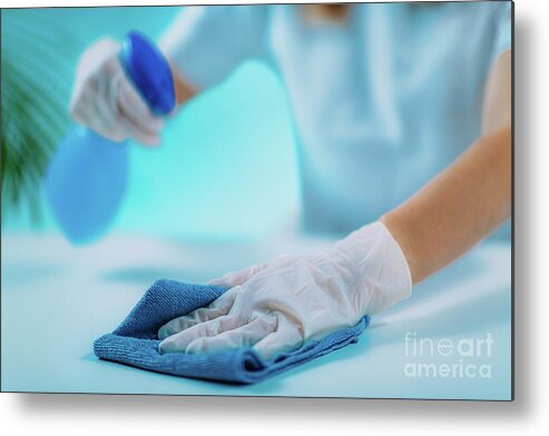 Surface Metal Print featuring the photograph Woman Disinfecting Surface by Microgen Images/science Photo Library