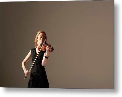 Mid Adult Women Metal Print featuring the photograph Woman Playing Violin by Moodboard