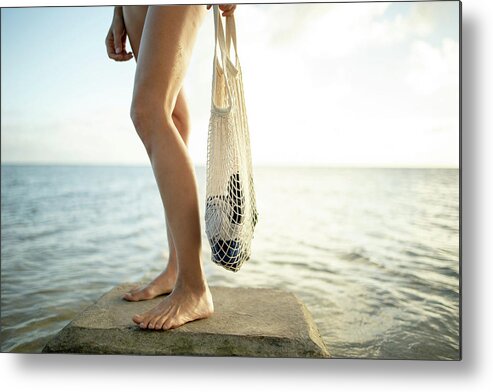 Beach Metal Print featuring the photograph Woman Standing With Her Reusable Tote Bag At A Beach In Honolulu by Cavan Images