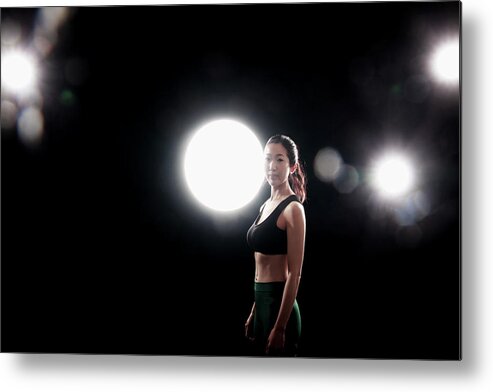 Three Quarter Length Metal Print featuring the photograph Young Woman Exercising by Runphoto