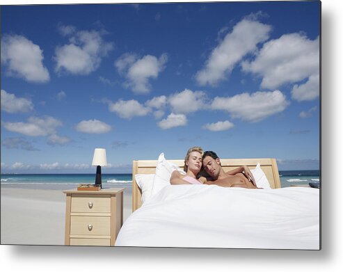 Mid Adult Men Metal Print featuring the photograph Couple Sleeping in a Bed on the Beach #1 by Digital Vision.