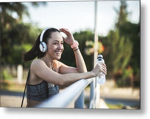 Music Metal Print featuring the photograph Fitness woman taking a break after running workout #1 by Zeljkosantrac