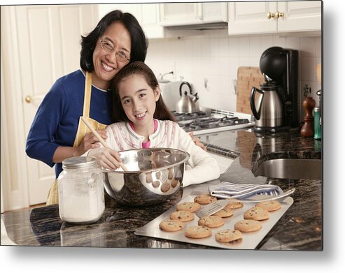 4-5 Years Metal Print featuring the photograph Grandmother and granddaughter baking cookies #1 by Comstock Images