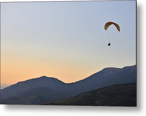 Tranquility Metal Print featuring the photograph Paraglider flying in tandem, at sunset #1 by Sami Sarkis