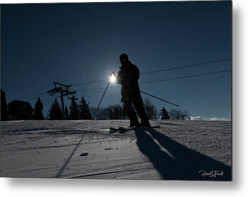 Skier Metal Print featuring the photograph Sunburst with skier making a silhouette #1 by Dan Friend