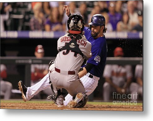 Baseball Catcher Metal Print featuring the photograph Todd Helton and Jordan Pacheco #1 by Doug Pensinger