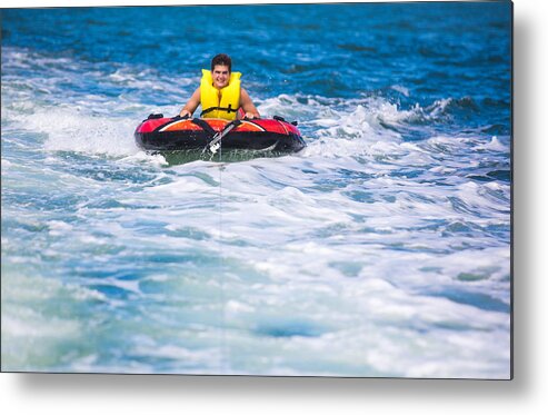Tubing Metal Print featuring the photograph Tubing behind boat #1 by Thepalmer