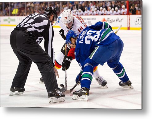 People Metal Print featuring the photograph Calgary Flames v Vancouver Canucks #17 by Rich Lam