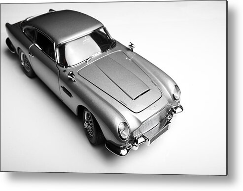 English Culture Metal Print featuring the photograph Aston Martin DB5 Model On White #2 by Simonbradfield