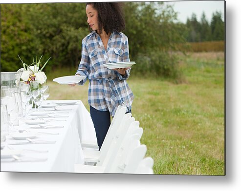 People Metal Print featuring the photograph Woman preparing table for dinner party in a field #2 by Image Source