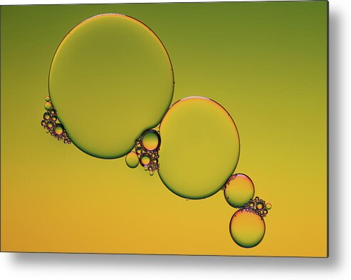Connection Metal Print featuring the photograph Bright abstract, yellow background with flying bubbles by Michalakis Ppalis