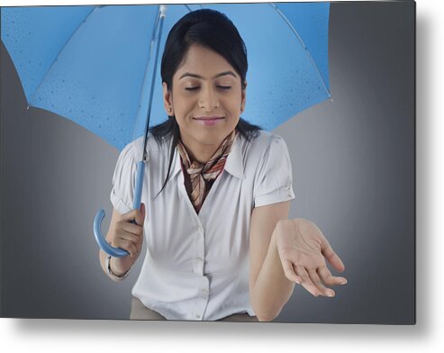 People Metal Print featuring the photograph Woman with umbrella enjoying the rain #3 by Abhinandita Mathur 