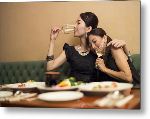 People Metal Print featuring the photograph Two girls having fun in party atmosphere. #4 by Michael H