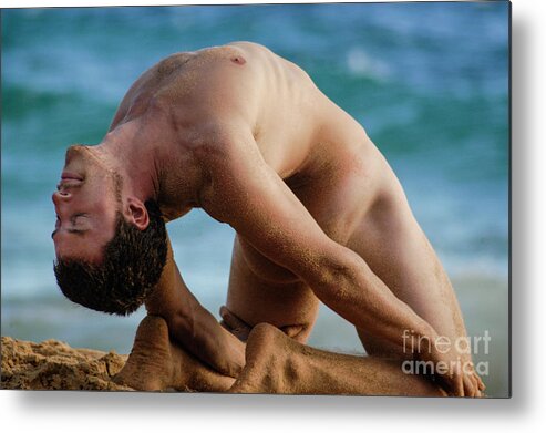 Nude Metal Print featuring the photograph A handsome flexible male surfer in a difficult yoga pose. by Gunther Allen