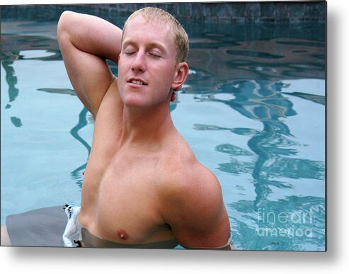 Blond Metal Print featuring the photograph A sexy and handsome young man poses in the pool. by Gunther Allen