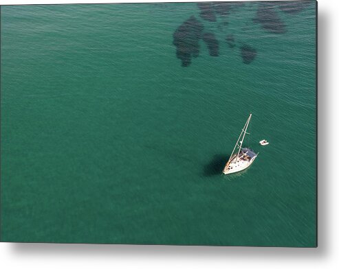 Anchored Metal Print featuring the photograph Aerial view of a luxury yacht anchored in the surface of the sea. Cyprus vacations by Michalakis Ppalis