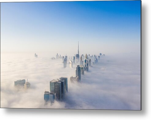 Dawn Metal Print featuring the photograph Aerial view of Dubai frame and skyline covered in dense fog during winter season by Captured Blinks Photography