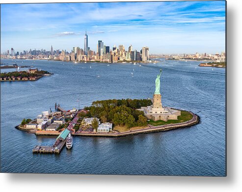 Lower Manhattan Metal Print featuring the photograph aerial view of the statue Liberty island in front of Manhattan skyline. New York. USA by Eloi_Omella