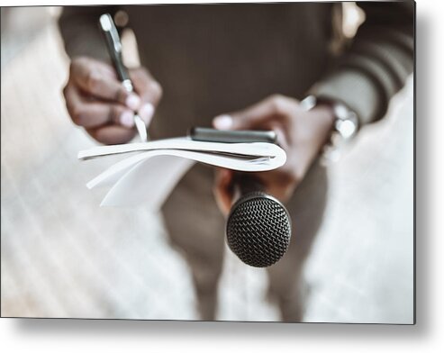 African Ethnicity Metal Print featuring the photograph African Male Journalist Preparing Questions For Press Conference by AleksandarGeorgiev