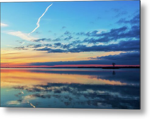 Sundown Metal Print featuring the photograph As the sun goes down on the water by Tatiana Travelways