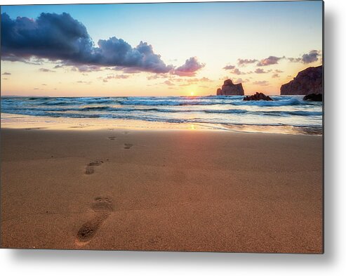 Southern Italy Metal Print featuring the photograph Beautiful and warm sunset with little clouds. Footprints in the sand in the foreground, Pan di Zucchero in the background. Masua beach, Sardinia, Italy, Europe by Andrea Comi
