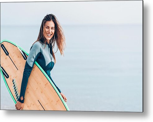 Recreational Pursuit Metal Print featuring the photograph Beautiful female surfer, with copy space by Pixelfit