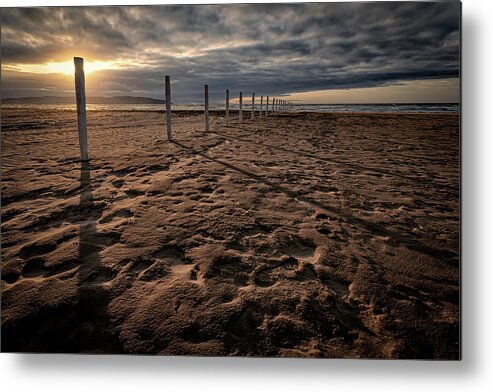 Downhill Metal Print featuring the photograph Benone Beach Posts by Nigel R Bell