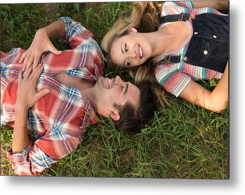 Young Men Metal Print featuring the photograph Birdseye view of couple on a picnic by Christopher Malcolm
