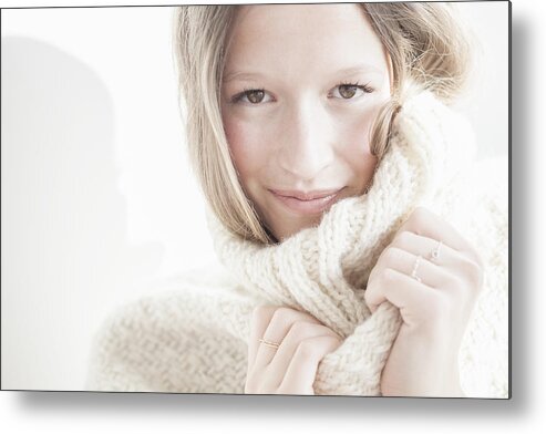 Sweater Metal Print featuring the photograph Blond woman wears a cosy woolen pull-over by Letizia McCall