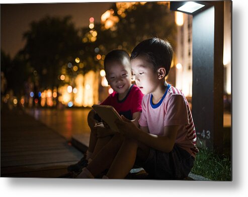 Telephone Metal Print featuring the photograph Boy Using tablet PC by Real444
