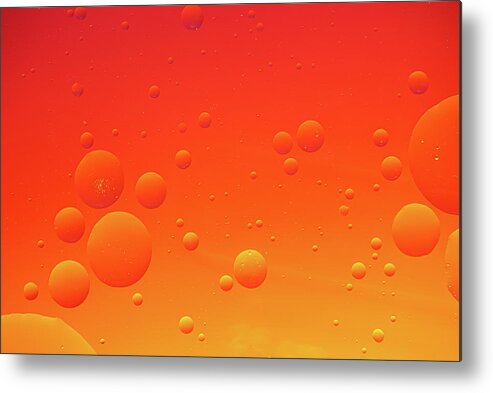 Abstract Metal Print featuring the photograph Bright abstract, red background with flying bubbles by Michalakis Ppalis