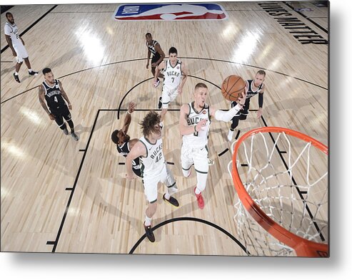 Nba Pro Basketball Metal Print featuring the photograph Brooklyn Nets v Milwaukee Bucks by David Dow
