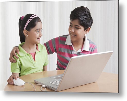 Sibling Metal Print featuring the photograph Brother and sister with laptop by Sudipta Halder