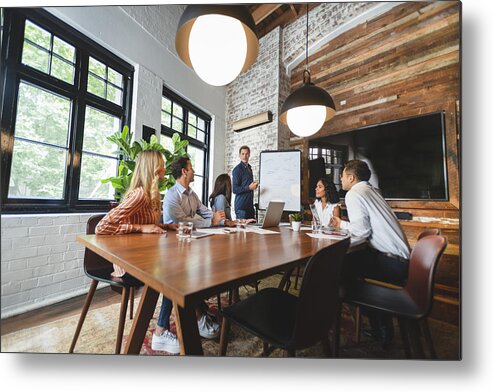 Expertise Metal Print featuring the photograph Business people watching a presentation on the whiteboard by Courtneyk