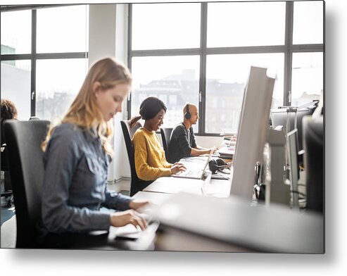 New Business Metal Print featuring the photograph Business professionals working at their desks by Luis Alvarez