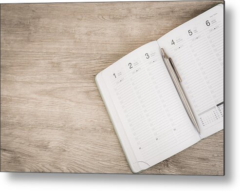Working Metal Print featuring the photograph Calendar, smartphone, tablet. Workplace with tablet pc and smartphone on table close-up by Levente Bodo