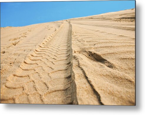 Dust Metal Print featuring the photograph Car tracks on sand by MediaProduction