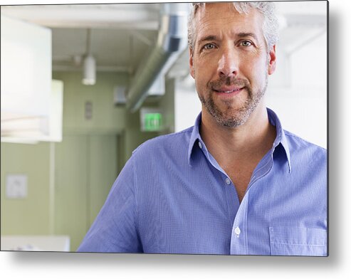 Mature Adult Metal Print featuring the photograph Caucasian businessman standing in office by Don Mason