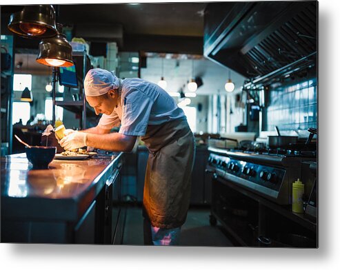 Expertise Metal Print featuring the photograph Chef serving food by NoSystem images