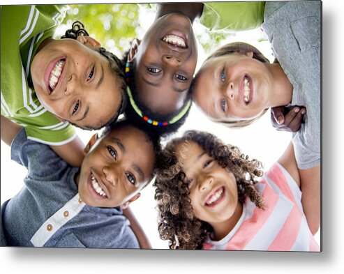 Directly Below Metal Print featuring the photograph Children Smiling in a Huddle by FatCamera